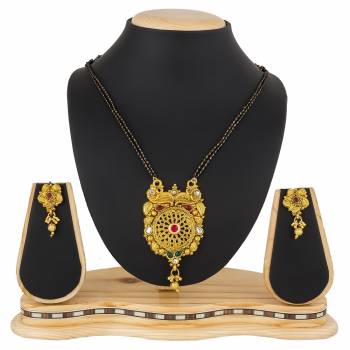 Here Is A Heavy Patterned Mangalsutra In Golden Color With Pretty Set Of Earrings. This Mangalsutra Is Suitable For Function OR Wedding Wear. It Can Be Paired With Any Colored Attire. 