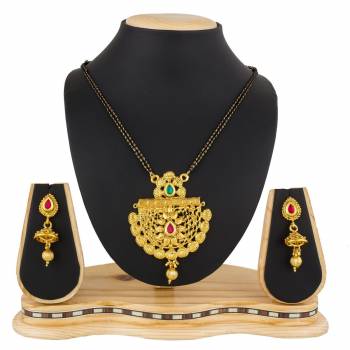 Here Is A Heavy Patterned Mangalsutra In Golden Color With Pretty Set Of Earrings. This Mangalsutra Is Suitable For Function OR Wedding Wear. It Can Be Paired With Any Colored Attire. 