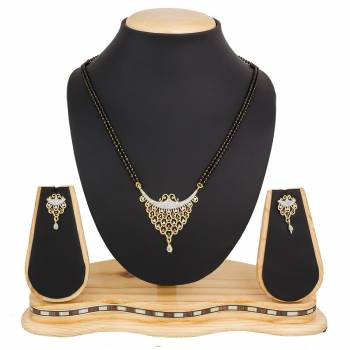 Instead Of Those Heavy Necklace, Carry This Beautiful And Elegant Looking Mamgalsutra Set At The Next Party You Attend. It Is Beautified With Diamond Work And You Can Pair This Up With Any Colored Attire.