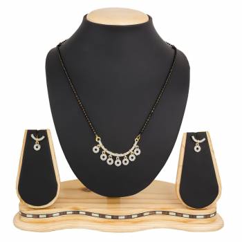 Instead Of Those Heavy Necklace, Carry This Beautiful And Elegant Looking Mamgalsutra Set At The Next Party You Attend. It Is Beautified With Diamond Work And You Can Pair This Up With Any Colored Attire.