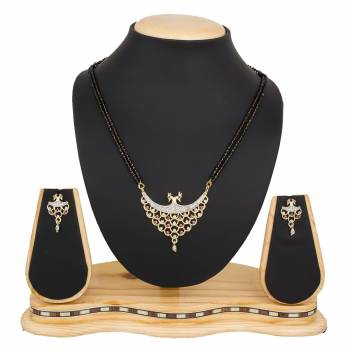 Instead Of Those Heavy Necklace, Carry This Beautiful And Elegant Looking Mamgalsutra Set At The Next Party You Attend. It Is Beautified With Diamond Work And You Can Pair This Up With Any Colored Attire.