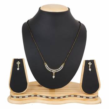 Instead Of Those Heavy Necklace, Carry This Beautiful And Elegant Looking Mamgalsutra Set At The Next Party You Attend. It Is Beautified With Diamond Work And You Can Pair This Up With Any Colored Attire.