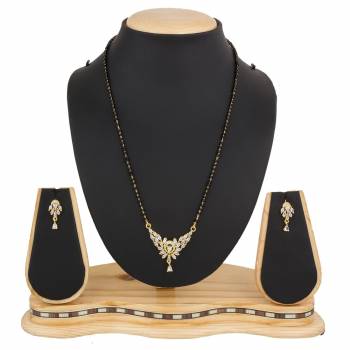 Instead Of Those Heavy Necklace, Carry This Beautiful And Elegant Looking Mamgalsutra Set At The Next Party You Attend. It Is Beautified With Diamond Work And You Can Pair This Up With Any Colored Attire.