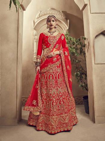 Get Ready For The D-Day With This Beautiful Heavy Designer Lehenga Choli In Red Color Paired With Red Colored Dupatta. Its Blouse And Lehenga Are Velvet Fabricated Paired With Net Fabricated Dupatta. It Has Heavy Embroidery All Over It Giving It A Lovely Glam Look.