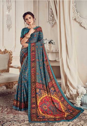 Add This Pretty Blue Colored Saree To Your Wardrobe Paired With Blue Colored Blouse. This Saree And Blouse Are Georgette Fabricated Beautified with Checks Prints. It Is Light Weight And Easy To Drape. 