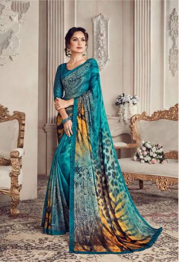 Add This Pretty Blue Colored Saree To Your Wardrobe Paired With Blue Colored Blouse. This Saree And Blouse Are Georgette Fabricated Beautified with Checks Prints. It Is Light Weight And Easy To Drape. 