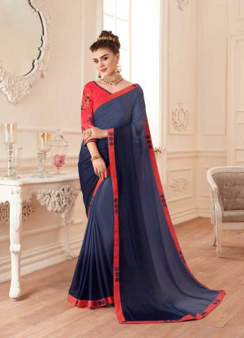 Enhance Your Personality Wearing This Designer Saree In Navy Blue Color Paired With Contrasting Crimson Red Colored Blouse. This Saree And Blouse Are Silk Based Beautified With Embroidery Over The Blouse And Saree Lace Border. 