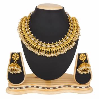 Give A Rich And Elegant Look To Your Neckline Wearing This Elegant Looking Necklace Set In Golden Color. This Necklace Set Be Paired With Any Colored Ethnic Attire. Buy Now.