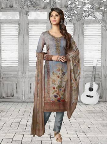 Enhance Your Personality Wearing this Designer Semi-Stitched Suit In Grey Color Paired With Grey And Multi Colored Dupatta. Its Top Is Fabricated On Soft Cotton Paired With Cotton Bottom And Chiffon Dupatta. It Is Beautified With Prints And Resham Embroidery And Stone Work. 