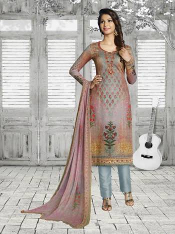 Go Colorful Wearing This Attractive Semi-Stitched Straight Suit In Multi Colored Top And Dupatta Paired With Grey Colored Bottom. Its Top IS Fabricated On Soft Cotton Paired With Cotton Bottom And Chiffon Dupatta. Buy Now.