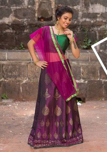 This Wedding Season, Give A Unqiue Look To Your Wear Making Her Wear This Beautiful Lehenga Choli In Dark Green Colored Blouse Paired With Contrasting Magenta Pink Colored Lehenga And Dupatta. Its Blouse And Lehenga Are Soft Silk Based Paired With Net Dupatta. all Its Fabrics Ensures Superb Comfort Throughout The Gala.