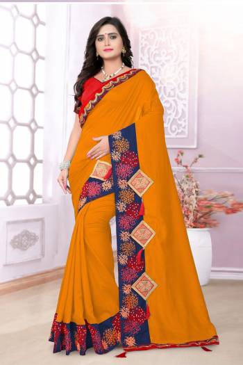 Grab This Beautiful Silk Based Saree In Musturd Yellow Color Paired With Contrasting Red Colored Blouse. This Saree And Blouse Are Fabricated On Art Silk Beautified With Embroidery And Patch Work. Also The Silk Fabric Gives A Rich Look To Your Personality. Buy Now.