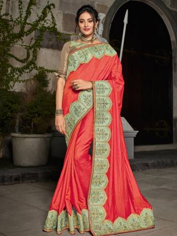 Indian Women presents this orange color two tone silk saree. look gorgeous at an upcoming any occasion wearing the saree. this party wear saree won't fail to impress everyone around you. Its attractive color and designer heavy embroidered design, Flower patch design, zari work, stone design, beautiful floral design work over the attire & contrast hemline adds to the look. Comes along with a contrast unstitched blouse.