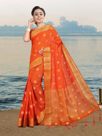 This Festive Season, Adorn A Rich And Elegant Looking Silk Based Saree In Orange Color Paired With Orange Colored Blouse. Its Fabric And Color Will Earn You Lots Of Compliments From Onlookers. 