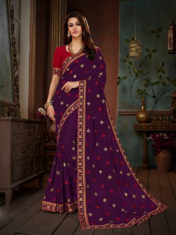 Add This Beautiful Designer Saree To Your Wardrobe In Purple Color Paired With Contrasting Red Colored Blouse. This Saree And Blouse Are Silk based Beautified With Embroidery All Over. This Saree Is Suitable For Party Or Any Festive Wear.