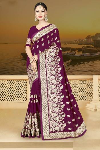 Bright Color Gives An Attractive Look To Your Personality, So Grab This Beautiful Designer Saree In Wine Color Paired With Wine Colored Blouse. This Saree And Blouse Are Silk Based Beautified With Heavy Jari Work. Buy Now.