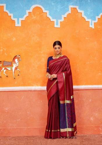 For a Royal Look, Grab This Silk Based Saree In Maroon Color Paired With Violet Colored Blouse. This Saree And Blouse Are Fabricated On Handloom Art Silk Beautified With Weave. Its Rich Color And Fabric Will Earn You Lots Of Compliments From Onlookers. 