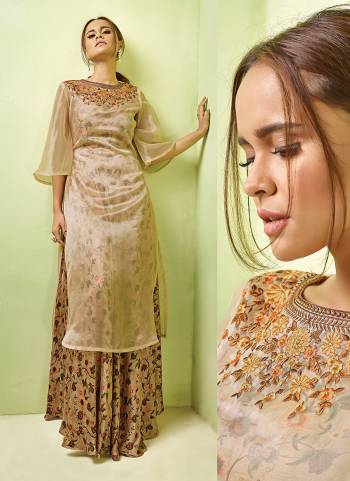 Grab This Rich And Elegant Looking Designer Readymade Gown In Beige Color Paired With Beige Colored Top. This Gown Is Fabricated On Satin Paired With Orgenza Fabricated Top.