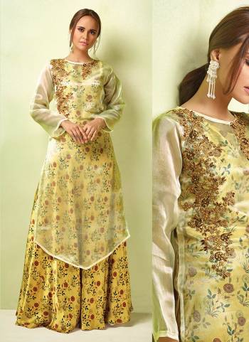 Celebrate This Festive Season with Beauty And Comfort Wearing This Designer Readymade Gown In Yellow Color Paired With Contrasting Pastel Green Colored Top Over It. You Can Wear It Both Ways Either Only Gown Or With Top. Buy Now.