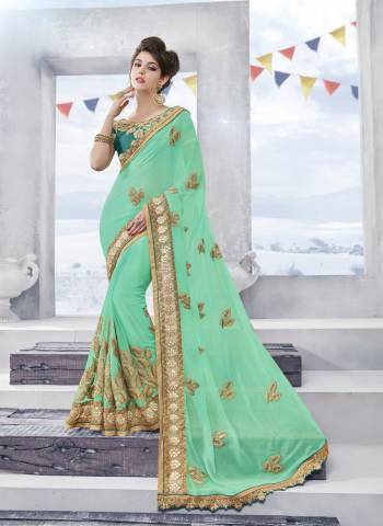 Another Pretty Shade Is Here Green With This Designer Saree In Sea Green Color Paired With Teal Green Colored Blouse. This Saree Is Fabricated On Chiffon Paired With Art Silk Fabricated Blouse. Buy Now.