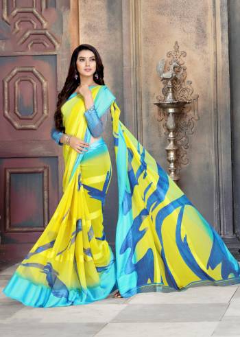 Look Attractive In This Pretty Yellow And Sky Blue Colored Saree Paired With Sky Blue Colored Blouse. This Saree Is Georgette Based With Satin Patta And Bold Prints Over It. Buy Now.