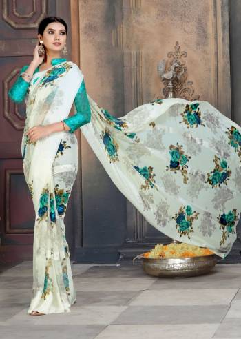 Simple And Elegant Looking Printed Saree In Here In Off-White Color Paired With Sea Green Colored Blouse. This Saree And Blouse Are Georgette Based Beautified With Satin Patta And Floral Prints All Over.