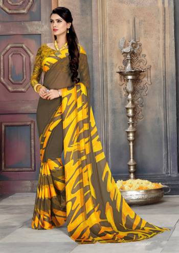 Catch All The Lime light In This Sand Grey And Yellow Colored Saree Paired With Sand Grey And Yellow Colored Blouse. This Saree And Blouse Are Georgette Based Beautified with Prints And Satin Patta. 