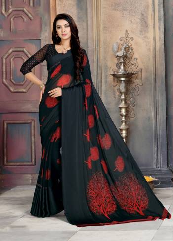 For A Bold And Beautiful Look, Grab This Saree In Black Color Paired With Black Colored Blouse. This Saree Is Georgette Fabricated Beautified With Prints And Satin Patta. 