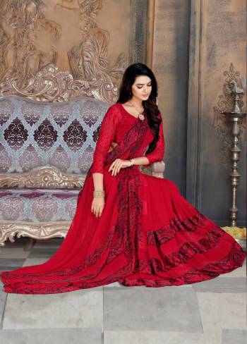 Adorn The Pretty Angelic Look Wearing This Saree In Red Color Paired With Red Colored Blouse. This Saree And Blouse Are Georgette Based Beautified With Prints And Satin Patta. 