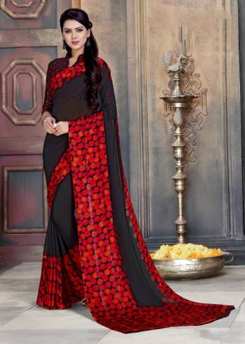 Add This Bold Looking Saree To Your Wardrobe For Casual Or Semi-Casual Wear In Black And Red Color Paired With Black And Red Colored Blouse. This Saree Is Fabricated On Georgette Paired With Satin Georgette Blouse. 