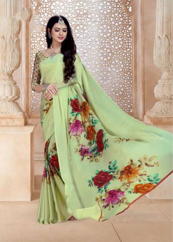 This Season Is About Subtle Shades And Pastel Play, So Grab This Saree In Pastel Green Color Paired With Pastel Green Colored Blouse. This Saree And Blouse Are Fabricated On Satin Georgette Beautified With Bold Multi Colored Floral Prints. 