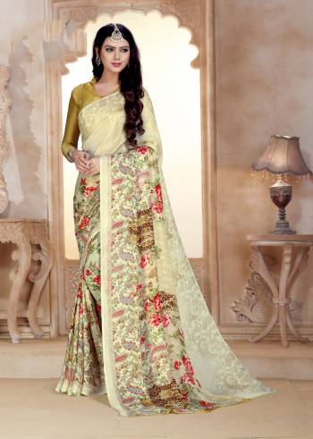 Flaunt Your Rich And Elegant Taste Wearing This Saree In Cream Color Paired With Beige Colored Blouse. This Saree And Blouse Are Satin Georgette Based Beautified With Contrasting Floral Prints. Also It Is Soft Towards Skin Which Is Easy To Carry All Day Long. 