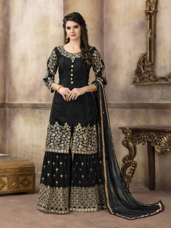 For A Bold And Beautiful Look, Grab This Designer Sharara Suit In Black Color Paired With Black Colored Bottom And Dupatta. Its Top Is Fabricated On Art Silk Paired With Georgette Bottom And Net Dupatta. 