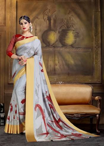 Flaunt Your Rich And Elegant Taste Wearing This Designer Silk Based Printed Saree In Grey Color Paired With Maroon Colored Blouse. It Has Very Abstract Print Giving It An Attractive Look.