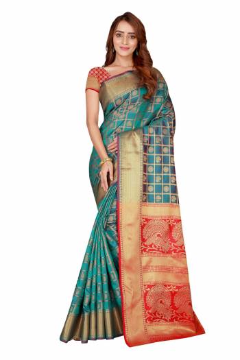 Here Is A Very Pretty Color Pallete With this Silk Based Saree In Turquoise Blue And Red Color Paired With Red Colored Blouse. This Saree And Blouse Are Fabricated On Kanjivaram Art Silk Beautified With Heavy weave All Over It. Buy This Designer Silk Saree Now.