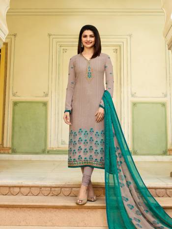 Flaunt Your Rich And Elegant Taste Wearing This Designer Straight Suit In Pale Grey Color Paired With Grey And Sea Green Dupatta. Its Top Is Crepe Fabricated Paired With Santoon Bottom And Chiffon Dupatta. All Its Fabric Ensures Superb Comfort All Day Long. 