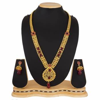 Here Is A Beautiful Long Pattern Necklace Set In Golden Color Beautified with Stone Work And Pair With A Lovely Pair Of Earrings. You Can Pair This Up With Any Colored Traditional Attire. 