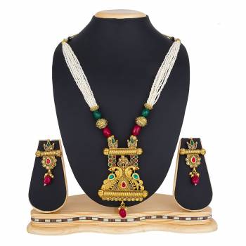 Here Is A Beautiful Long Pattern Necklace Set In Golden Color Beautified with Stone Work And Pair With A Lovely Pair Of Earrings. You Can Pair This Up With Any Colored Traditional Attire. 