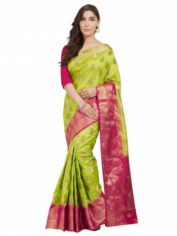 Catch All The Limelight Draping This Beautiful Parrot Green And Rani Pink Colored Saree Paired With Rani Pink Colored Blouse. This Saree And Blouse are Fabricated On Nylon Silk Beautified With Weave. 