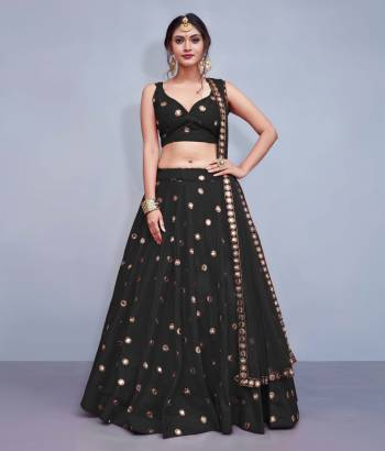 Grab This Designer Readymade Lehenga Choli For The Upcoming Wedding Season. This Lehenga Choli Is In Black Fabricated On Art Silk Paired With Black Colored Net Fabricated Dupatta. It Is Beautified With Attractive Mirror Work. Buy Now.