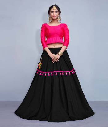 This Festive Season, Look The Most Unqiue And Trendy With This Designer Readymade Lehenga Choli In Fuschia Pink Colored Blouse Paired With Contrasting Black Colored Lehenga. Its Blouse Is Silk Based With Cotton Fabricated Lehenga. It IS Beautified With Multi Colored Tassels And Lace. 