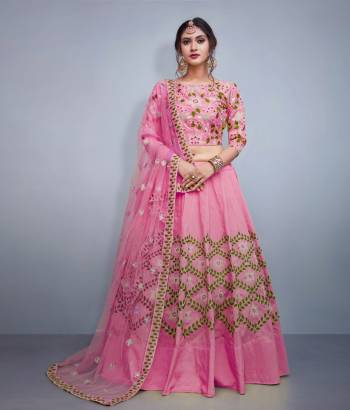 Look The Most Prettiest Of All Wearing This Heavy designer Lehenga Choli In Pink Color. Its Blouse And Lehenga Are Silk Based Paired With Net Fabricated Dupatta. Also It IS Beautified With Heavy Embroidery All Over. 