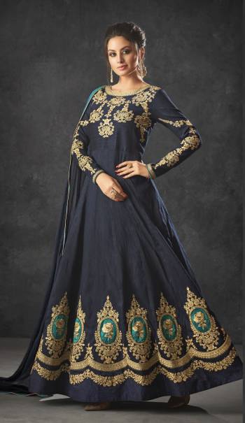 Enhance Your Personality Wearing This Designer Floor Length Suit In Navy Blue Color. Its Top Is Silk Based With Santoon Bottom And Chiffon Dupatta. Buy This Semi-Stitched Suit Now,