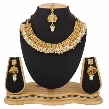 Give An Enhanced Look, Even To Your Simple Traditional Attire With This Beautiful Set Of Necklace In Golden Color. It Is Light In Weight And Can Be Carried Comfortably Throughout The Gala. Buy Now.