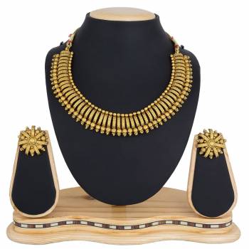 Add Glam To Your Attire Pairing It With This Lovely Set Of Necklace In Golden Color. This Can Be Paired With Any Colored Traditional Attire. Buy Now.