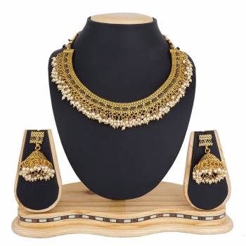 Give An Enhanced Look, Even To Your Simple Traditional Attire With This Beautiful Set Of Necklace In Golden Color. It Is Light In Weight And Can Be Carried Comfortably Throughout The Gala. Buy Now.