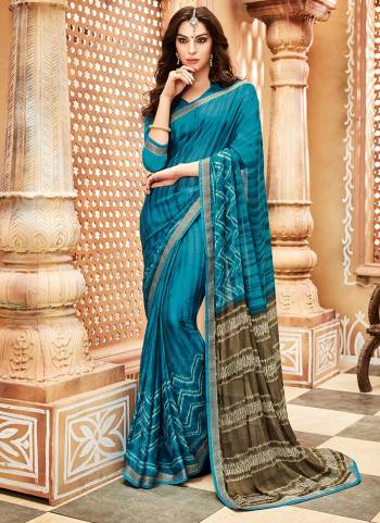 Here Is A Pretty Light Weight Saree Which Ensures You Superb Comfort For Casuals Or Semi-Casuals. This Saree Is Fabricated On Chiffon Georgette Paired With Soft Silk Fabricated Blouse. It Is Beautified with Prints All Over. 