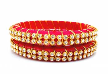 Add A Little More Glam To Look With This Beautiful Bangle Set Made With Resham Thread And Beautified with Stone Work. It Can Be Paired With Same Or Any Contrasting Colored Thraditional Attire. Buy Now.