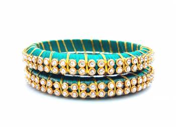 Add A Little More Glam To Look With This Beautiful Bangle Set Made With Resham Thread And Beautified with Stone Work. It Can Be Paired With Same Or Any Contrasting Colored Thraditional Attire. Buy Now.