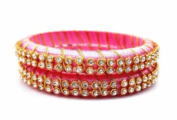 Add A Little More Glam To Look With This Beautiful Bangle Set Made With Resham Thread And Beautified with Stone Work. It Can Be Paired With Same Or Any Contrasting Colored Thraditional Attire. Buy Now.